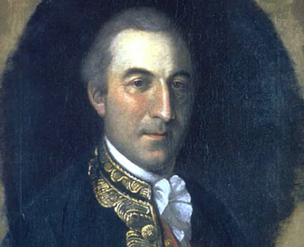 A portrait of a man wearing a dark blue coat with gold trimmings and a white ruffled shirt. 
